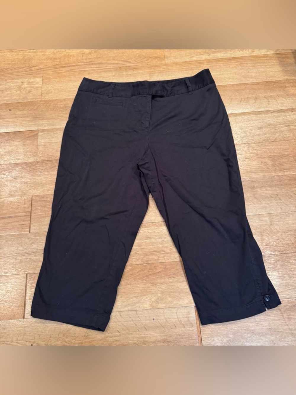 Black capris with button detail
